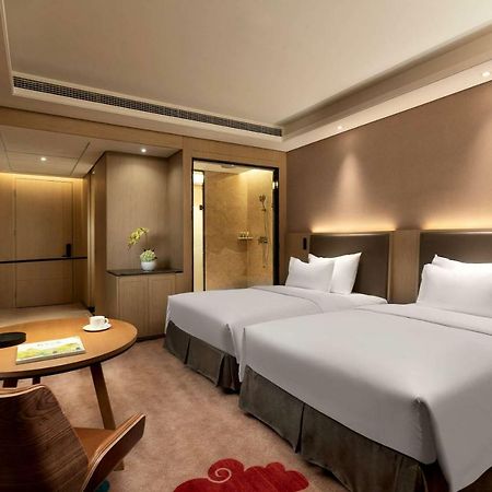 Hotel Ramada Wyndham Zhengzhou Xinzheng à Xinzheng  Extérieur photo