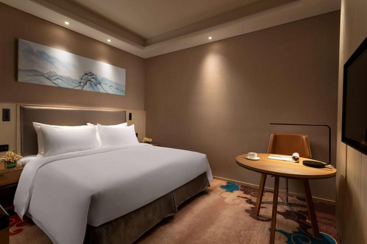 Hotel Ramada Wyndham Zhengzhou Xinzheng à Xinzheng  Extérieur photo